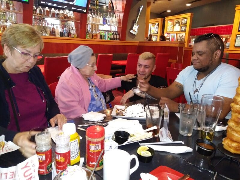 Family sitting at table in restaurant