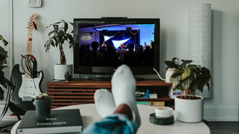 person watching church on tv