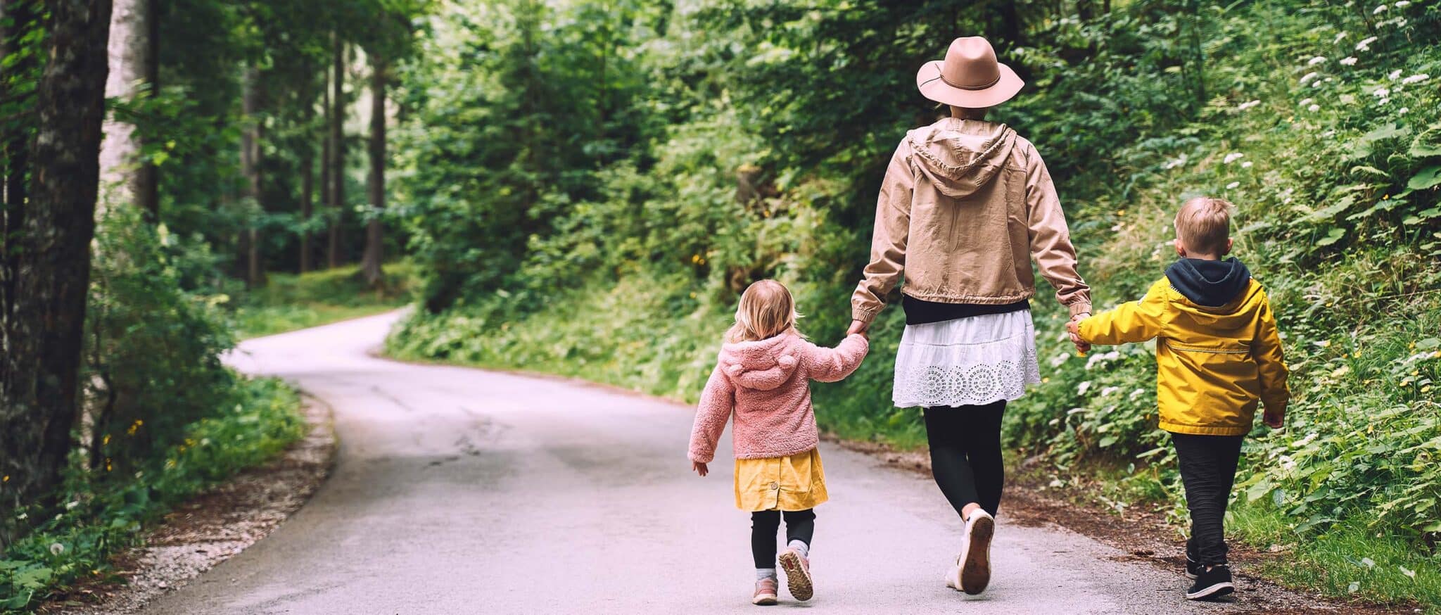 family walking in woods