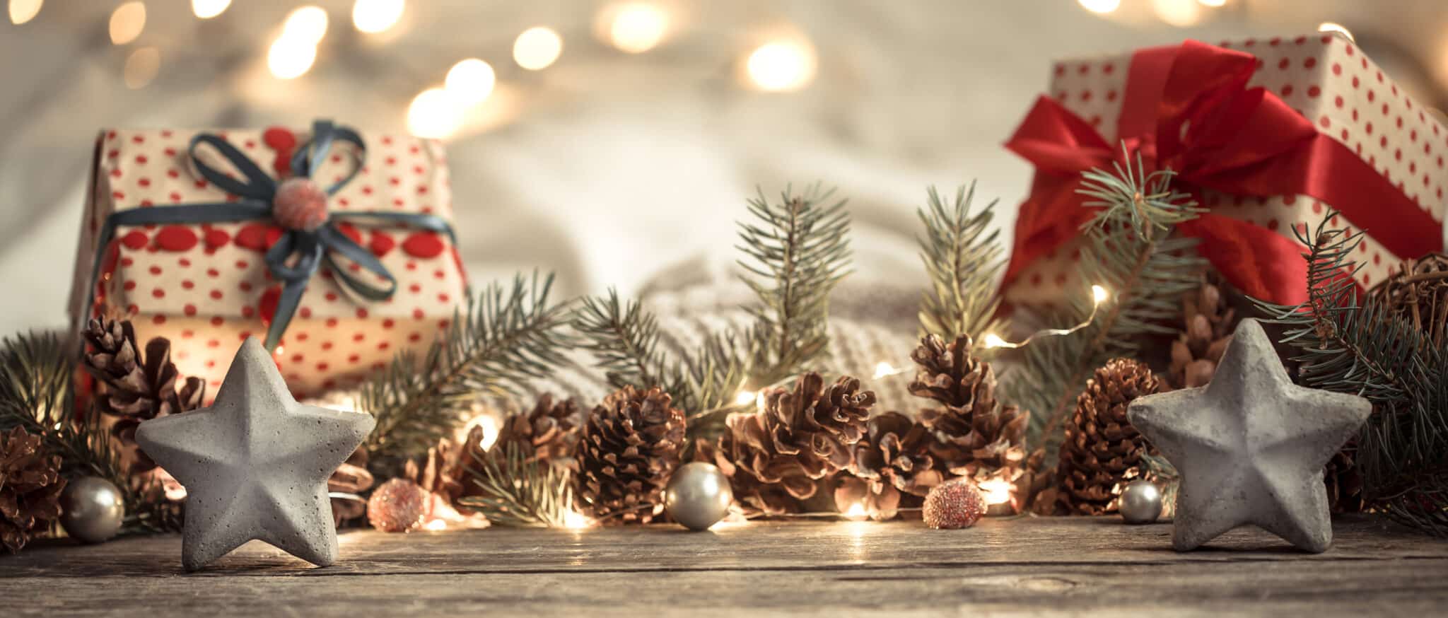 presents with pinecones and christmas lights