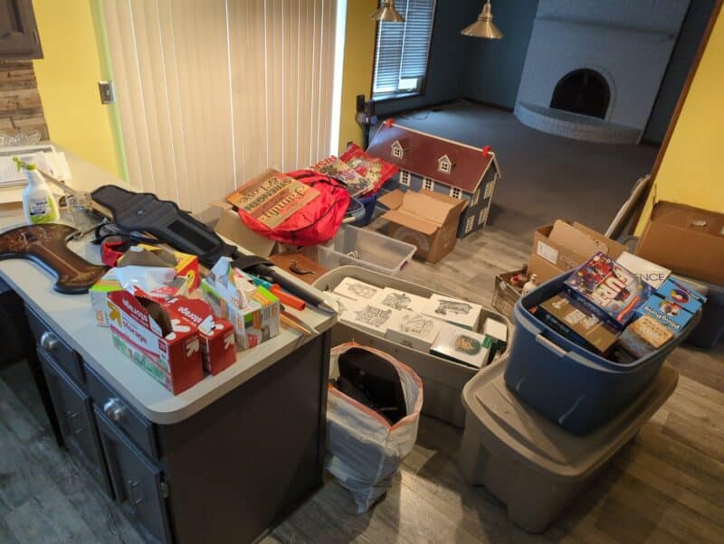 Kitchen filled with boxes being packed for moving.