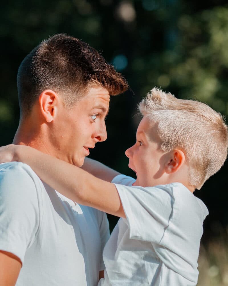 Father and Son looking at each other and making faces.