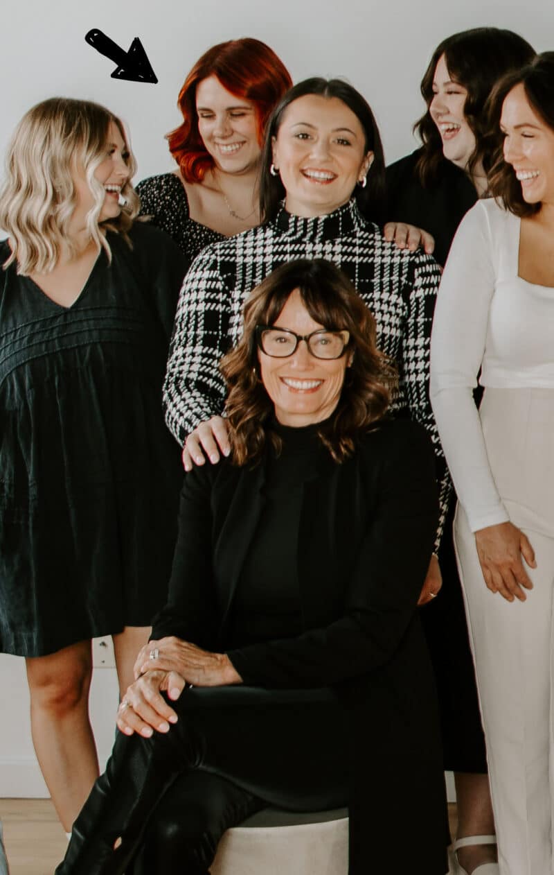 Work group photo of smiling ladies.