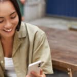 Happy woman reading text.