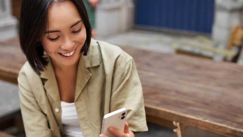 Happy woman reading text.