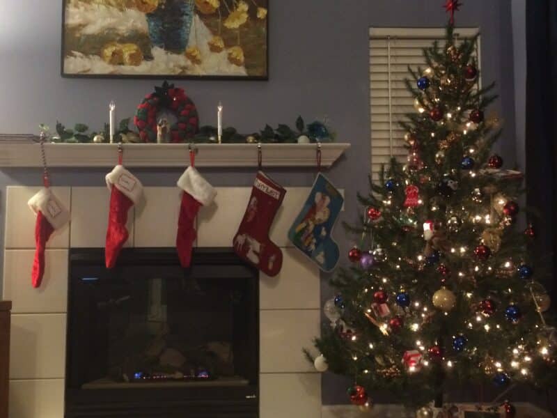 Christmas stocking above fireplace.