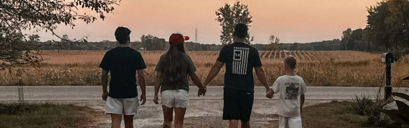 Family walking away down driveway