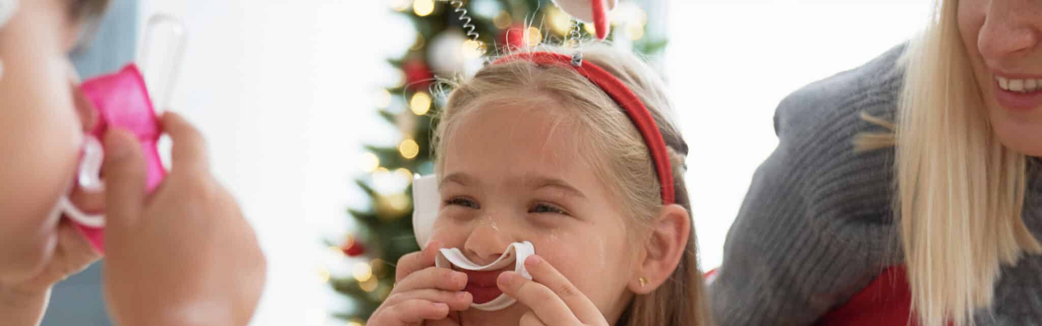 kids smiling making cookies christmas blog header