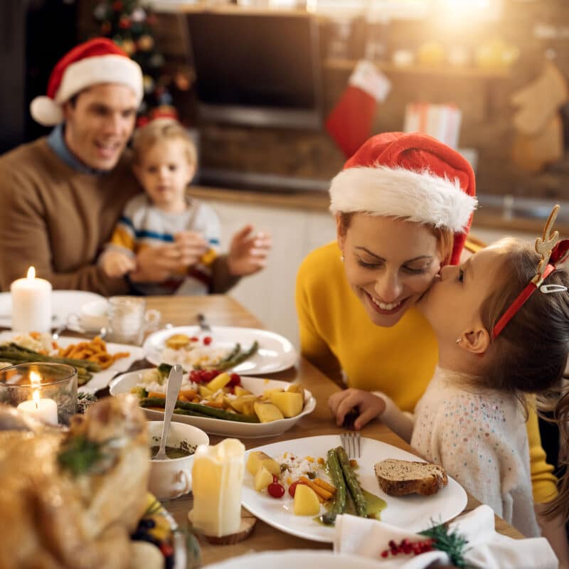 family having christmas dinner together