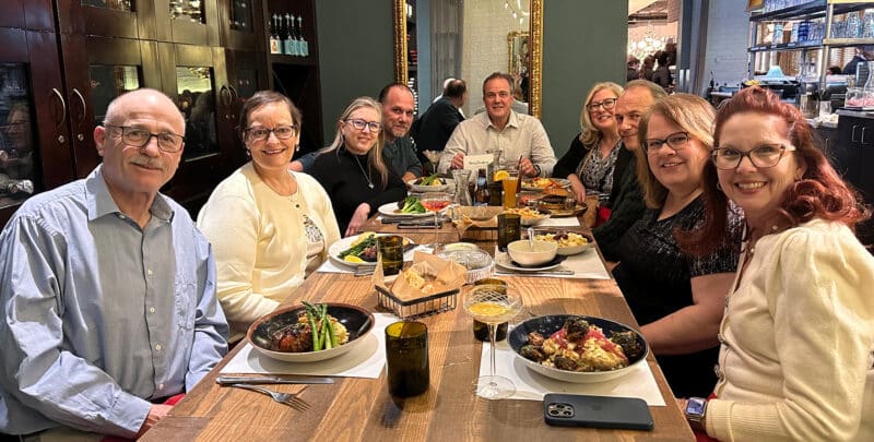Large group of happy people having dinner
